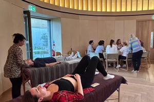 at-and-women-sitting.jpeg - Wellbeing Workshops for Ukrainian Women