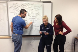 coaches-at-the-whiteboard.jpeg - West Lothian Wolves Lair Project