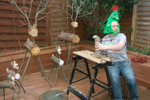 ex-res-jd-designing-reindeers-out-back.jpg - Recycled wood workshop for young homeles