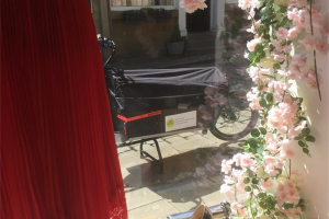 220514-bike-through-window-of-re-dress-boutique-kfw.jpg - Holme Deliveries
