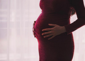 freestocks-org-pregnant-woman-wearing-red-long-sleeved-dress.jpg