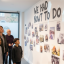 inside-a-colorful-community-library-a-black-man-in-his-50-s-intently-looks-at-a-black-and-white-phot.png