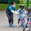 two-girls-learning-to-ride-a-bike.jpeg