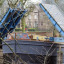 barge-coming-under-blue-bridge.jpg